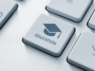 Close-up of a keyboard key with a graduation cap icon and the word EDUCATION.