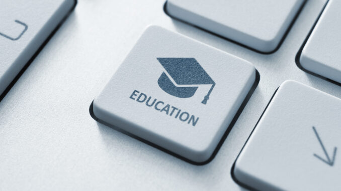 Close-up of a keyboard key with a graduation cap icon and the word EDUCATION.